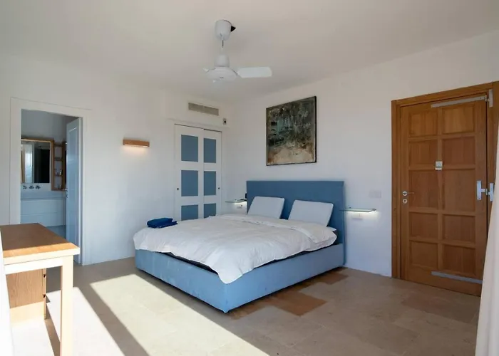 Dea Overlooking The Harbor Of Порто-Черво